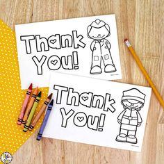 two thank you cards with crayons and pencils next to them on a table