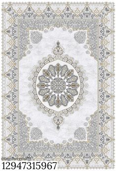 an intricately designed rug in grey and white