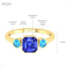 Description Behold the beauty of our dazzling 14k gold tanzanite & swiss topaz combination ring. Crafted in 14k gold, this ring is dressed with octagon tanzanite and round swiss blue topaz accented side by side. Surprise your love one with this beauty. Product Details SKU CJ R 1782 TZ Product dimension - Metal 14K Solid Gold Birthstone December TANZANITE DETAILS Size 6mm Quality AAA Pieces 1 Weight 1.75 carats Setting Bezel Enhancement Heated SWISS BLUE TOPAZ DETAILS Size 3mm Quality AAA Pieces Laos Jewelry, Diamond Bezel Ring, Bezel Ring, Natural Tanzanite, Swiss Blue Topaz, Three Stone Rings, Bezel Diamond, Beauty Product, Side By Side