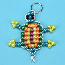 a colorful beaded frog keychain on a blue background