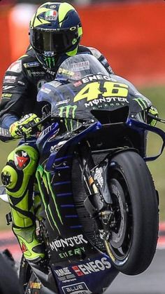 a man riding on the back of a motorcycle