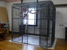 a cage that is in the middle of a room