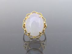 Vintage 18K Solid Yellow Gold Oval Natural Purple Lavender, Green Jadeite Jade Filigree Ring....Marked 18k ...Total of weights 5.2grams...Size 7.5...Measure of Jade 16.7 x 13MMIt's in very good condition. #441921 A01 Elegant Chalcedony Opal Ring For Anniversary, Vintage Chalcedony Round Jewelry, Vintage Chalcedony Jewelry, Vintage White Opal Ring For Formal Occasions, Elegant White Opal Collectible Ring, Vintage Oval Chalcedony Jewelry, White Chalcedony Rings For Weddings, Ladies Gold Rings, Vintage Bangle Bracelets