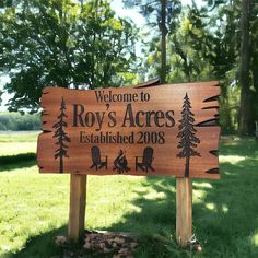 a wooden sign that is in the grass