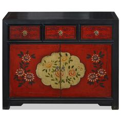 a red and black cabinet with flowers painted on it