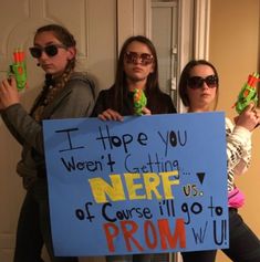 three girls holding up signs in front of a door that say i hope you were cutting here cause ill go to prom