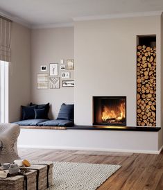 a living room filled with furniture and a fire place next to a window on top of a hard wood floor