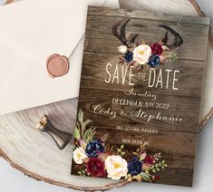 an image of save the date card with antlers and flowers on it next to envelope