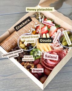 a box filled with different types of food and labeled in the words gouada