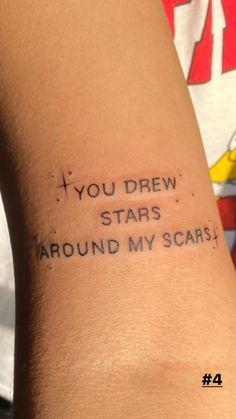 a woman's arm with the words you drew stars around my scars on it