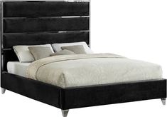 a black bed with white sheets and pillows on the headboard is in front of a white background