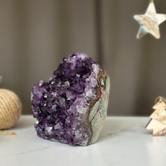 This amethyst crystal cluster has the highest quality of the semi precious stones. The deep purple shades with agate formations becomes this piece in a unique amethyst geode.  This geode was extracted from URUGUAY. It was extracted respecting the strict standards of open-pit mining in our country that ensure the safe work. YOU WILL RECEIVE THE AMETHYST OF THE PICTURE   FREE SHIPPING TO THE USA. ✧     MEASURES: XL cluster  Width: 3 in x Height: 4.5 in. Weight 2.4 lb (1127 gr) ✧     Our gemstones Purple Amethyst Geodes With Natural Stones, Purple Geodes With Natural Stones, Unique Purple Natural Stone Geodes, Unique Purple Geodes With Natural Stones, Open Pit, Amethyst Cathedral, Purple Shades, Stone Wrapping, Amethyst Geode