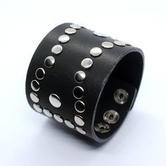 Dominic - oldschool design cuff bracelet for men or women. Wide platform - 5 cm can cover your wrist tattoo and also fix well. Cuff is decorated by rivets of rock style. Made of two layers of genuine leather, edges dyed. Bracelet is adjustable, there are 3 sizes 16,5 - 18 and 19 cm. Can be done in black or chocolate brown color. Suitable for wrist sizes from 16 till 19 cm, to get longer or shorten version contact me. ★ Similar style ★ ----------------------------- JD Matte black watches https:// Cheap Punk Bracelets With Rivets, Punk Cuff Bracelets With Rivets, Punk Style Leather Cuff Bracelet, Rock Style Rivets Wristband For Festivals, Rock Style Wristband With Rivets For Festivals, Black Leather Bracelet With Studs For Rock Style, Black Studded Leather Bracelet In Rock Style, Edgy Black Cuff Bracelet With Rivets, Punk Black Bracelet With Silver Studs