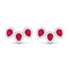 Product Details A classic piece with timeless appeal these Created Ruby Stud Earrings are adorned with the brilliant Pear Shape Created Ruby set in Prong Setting with Diamond Halo all around. These Bridal Earrings are crafted in Gold. These Three Stone Earrings are makes for a trendy and elegant choice for different occasions. Mark your promise to your blooming lady love with our Created Ruby and Diamond Earrings. Product Information SKU SHP-EARRINGS032210838 Length 14.3 mm Width 8.3 mm Height 3 Ruby And Diamond Earrings, Ruby Stud Earrings, Ruby Set, Halo 3, Ruby Earrings Studs, Ruby Earrings, Ruby Jewelry, Stone Studs, Ruby Diamond