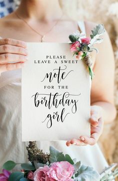 a woman holding a sign that says, please leave a sweet note for the birthday girl