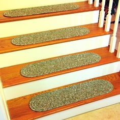 the carpeted stair treads have been placed on top of each other to protect them from falling