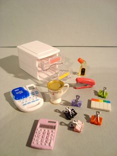 there is a small toy kitchen set on the table next to it's contents