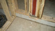 the inside of a house being built with wood framing and insulation on the floor,