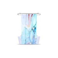 a shower curtain with an abstract design on the front and back side, hanging from a metal rod