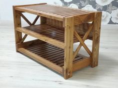 a wooden table with two shelves on each side