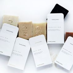 five bars of soap sitting next to each other on top of a white countertop