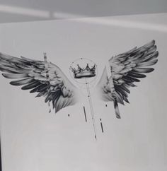 a black and white photo of two wings with a crown on it's back