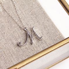 Silver M Pendant / Silver letter M Necklace / Dainty silver chain necklace / initial necklace / sterling silver chain / personalized jewelry Dainty "M" initial. Perfect every day necklace. Lovely gift for your self, sister, bridesmaids, new mom. Pendant: Base metal is brass and silver plated on top. Chain is 18 inches, sterling silver.  Note: model shots might show a different initial, only to illustrate overall look and length of the chain. This listing is for the "M" initial. Letter M Necklace, Every Day Necklace, M Necklace, Word Necklace, Alphabet Necklace, Gold Letter Necklace, Cursive Letters, Necklace Initial, Party Necklace