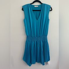 Alesia Pleated Satin Mini Dress By Blue Ramy Brook Size Extra Small Never Worn Ramy Brook Dress, Size Xs Blue V-neck Dress With Pleated Waist, Blue Sleeveless Midi Dress With Pleated Waist, Blue Pleated Knee-length Mini Dress, Blue Sleeveless Pleated Dress For Spring, Light Blue Pleated V-neck Dress, Blue Knee-length Pleated Summer Dress, Chic Blue A-line Pleated Dress, Blue Knee-length Pleated Dress For Spring, Blue Knee-length Pleated Dress For Summer