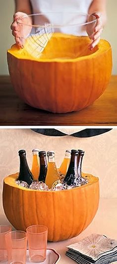 there is a pumpkin shaped like a bowl with bottles in it and two glasses on the side