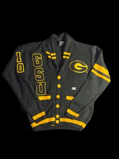 For a limited time, the Signature Brand is offering the GSU Varsity Pre-order Apparel: Cardigan uniquely designed with embroidered patches. Sizes are available in Small-4X. Pre-ordered apparel can take 25 days to manufacture and additional days to be receive in our inventory. There are no refunds on pre-ordered items (group/customized orders); please visit our website for additional FAQs: https://www.signaturebrandhtx.com/faq Again, thanks for your support. We can't wait to see you in our branded apparel!! Collegiate Cardigan For College In Fall, Collegiate Fall Cardigan For College, Collegiate Style Cardigan For Fall College Season, Fall Collegiate Style College Cardigan, Collegiate Style Fall Cardigan For College, Collegiate Long Sleeve Cardigan For College, Collegiate Cotton Long Sleeve Cardigan, Collegiate Long Sleeve Cotton Cardigan, Long Sleeve Collegiate Cardigan For College