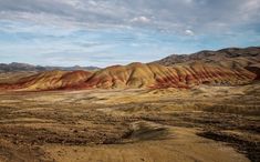 the mountains are painted with different colors