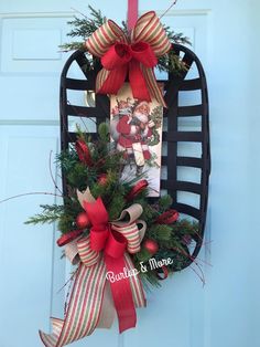 a christmas wreath hanging on the front door