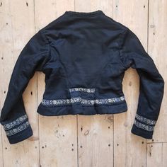 "1930s Eastern European folk jacket. Black cotton with a brushed cotton lining. Fitted and shaped to kick out at the back. The decorative ribbon is gorgeous in delicate lilacs. XXS Measures: 16\" underarm to underarm, 13\" shoulders, 16\" long in the body, 18\" sleeves Great condition. Freshly laundered. The lining looks a little grubby even though it has been washed, so it's just do to age and wear. Feel free to ask any questions. Ships internationally via insured and signed for delivery." Fitted Folk-style Cotton Outerwear, Folk Style Fitted Cotton Outerwear, Fitted Cotton Folk Outerwear, Fitted Embroidered Vintage Outerwear, Traditional Fitted Cotton Outerwear, European Costumes, Floral Ribbon, Theatre Costumes, Eastern European