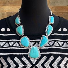 This Stunning Sterling Silver Statement Necklace By The Acclaimed Mixtec Artist Federico Jimenez Showcases Seven Natural Carico Lake Turquoise Stones In Enchanting Shades Of Blue. Each Stone Is Bezel Set Within Scalloped Frames Adorned With Crescent-Shaped And Circle Stampings Along With Raindrop Accents. The Necklace Features A Sturdy Bar And Circle Chain, Complemented By A Matching Decorative Stamped Hook And Eye Closure. The Center Back Of The Center Stone And The Two Stones Closest To The Ba Circle Chain, Silver Statement Necklace, Silver Necklace Statement, Turquoise Stones, Station Necklace, Turquoise Stone, Bezel Setting, Shades Of Blue, Crescent