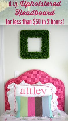 a bed with pink headboard and green wreath on the wall next to it is an ad for atley