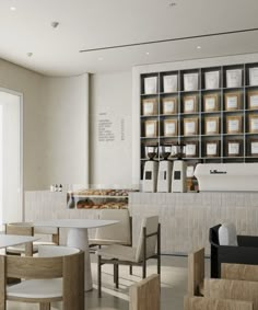 the interior of a coffee shop with tables and chairs