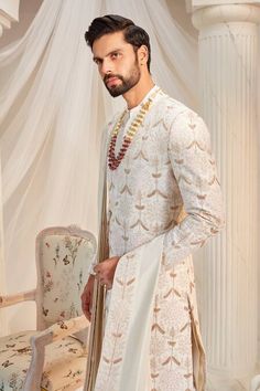 Buy Ivory Raw Silk Embroidered Glass Beads And Resham Floral Sherwani Set For Men by Rachit Khanna Online at Aza Fashions. White Bandhgala In Raw Silk With Traditional Drape, White Nehru Jacket With Dupatta For Wedding, Off White Raw Silk Sherwani For Transitional Season, Ceremonial Cream Raw Silk Sherwani, Ceremonial White Raw Silk Set, Traditional Cream Long Sleeve Sherwani, Traditional Long Sleeve Cream Sherwani, Transitional Off White Raw Silk Sherwani, Transitional Season Off White Raw Silk Sherwani