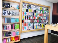 the phone store is filled with all kinds of cases and accessories for sale on shelves