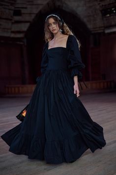 Channel the allure of a moonless night in this black high-waist midi dress. Its pleated puff skirt echoes the grandeur of galaxies, with a ruffled hem that flows like cosmic waves. Adorned with bows at the sleeve and waistline, and featuring practical pockets for small astronomy tools, it's ideal for stargazing sessions or presenting groundbreaking theories at twilight gatherings. Paper cotton floor length dress with full length puff sleeves Pleated puff skirt and ruffled hem Side seam pockets B Party Dress Elegant, Puff Skirt, Moonless Night, Skirt Swimsuit, Puff Dress, The Eclipse, Floor To Ceiling, Black High Waist, Knitted Coat