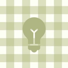 a light bulb with the letter y in it on a checkered tablecloth background