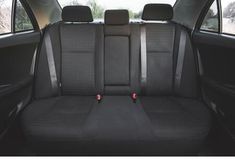 the back seats of a car are clean and ready for passengers to use in their cars