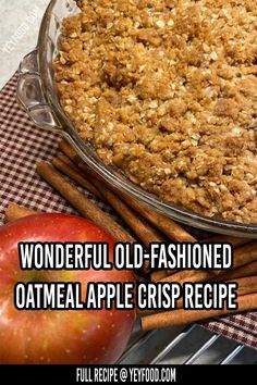 an apple pie sitting on top of a table next to cinnamon sticks and an apple