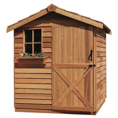 a wooden shed with the doors open and flowers growing on it's window sill