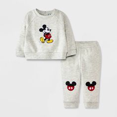 Your baby will look sweet and cozy wearing the Disney Mickey Mouse Chenille Patch Fleece Pullover and Pants Set. This gray outfit set includes a raglan-sleeve sweatshirt and a pair of jogger pants, both featuring Mickey chenille patches for an adorable look. The sweatshirt's back snaps make on-and-off easy, while the full elastic waistband helps keep the joggers in place. Crafted from midweight fabric, the pieces help keep your little one comfortable and are fun to mix and match with other cloth Baby Disney Outfits, Mickey Mouse Gifts, Disney Baby Clothes, Raglan Sleeve Sweatshirt, Chenille Patch, Newborn Boy Clothes, Grey Outfit, Boys Sweatshirts, One Clothing