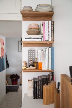 the bookshelf is filled with many different items