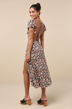 Be the cottage cutie you've been dreaming to be thanks to the Lulus Meadow Muse Black Floral Tie-Back Puff Sleeve Midi Dress! Lightweight woven fabric, decorated with a vintage-inspired floral print, shapes a lightly gathered triangle bodice, a sweetheart neckline accented with crocheted ladder lace, and short puff sleeves with elastic at the shoulders and cuffs. Two sets of tying straps secure atop an open back. A high, empire waist tops an A-line skirt that falls to a midi hem with a flirty si Empire Waist Tops, Lulu Fashion, Tie Backs, Empire Waist, Sweetheart Neckline, Floral Tie, Black Floral, Muse, A Line Skirts