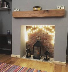 a living room with a fire place and some lights