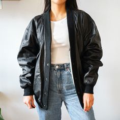 All items are handmade and personalized for the customers. 90's Oversized Bomber Jacket Retro Vintage Real Leather Jacket Gift for Her made officially by OX and Bulls, This Piece Will Ensure You Add The Right Amount Of Glam To Your Days. Highlights: Black Lambskin Asymmetric Edge Peplum Hem Notched Collar Off-Centre Front Zip Fastening Long Sleeves Two Zip-Fastening Chest Pockets Side Zip-Fastening Pocket Composition: Lining: Silk 100% Outer: Lambskin 100% TERMS AND CONDITIONS: 1. NO RETURNS OR Oversized Leather Jacket For Fall Streetwear, Trendy Oversized Varsity Jacket For Fall, Oversized Long Sleeve Leather Jacket For Streetwear, Oversized Leather Jacket For Streetwear, Oversized Black Retro Outerwear, Retro Black Outerwear For Fall, Oversized Urban Varsity Jacket For Fall, Oversized Varsity Jacket For Fall Streetwear, Retro Fall Outerwear For Streetwear