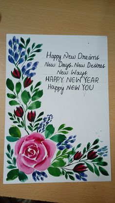 a happy new year card with flowers on it