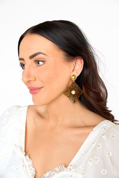 These gold beauties are a head turner! The Rombo earrings are light weight, 24K gold plated, and have a stud back. Add with any outfit to complete your look! This item is FINAL SALE. Gold Pearl Earrings With Brass, Gold Elegant Pearl Earrings, Gold Chic Bridal Earrings, Gold Single Plug Earring For Evening, Gold Clip-on Bridal Drop Earrings, Chic Gold Clip-on Pearl Earrings, Cheap Statement Gold-tone Earrings, Gold-plated Drop Chandelier Earrings, Gold-tone Brass Chandelier Earrings